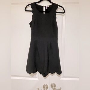 Like new Alya romper with scalloped sleeves